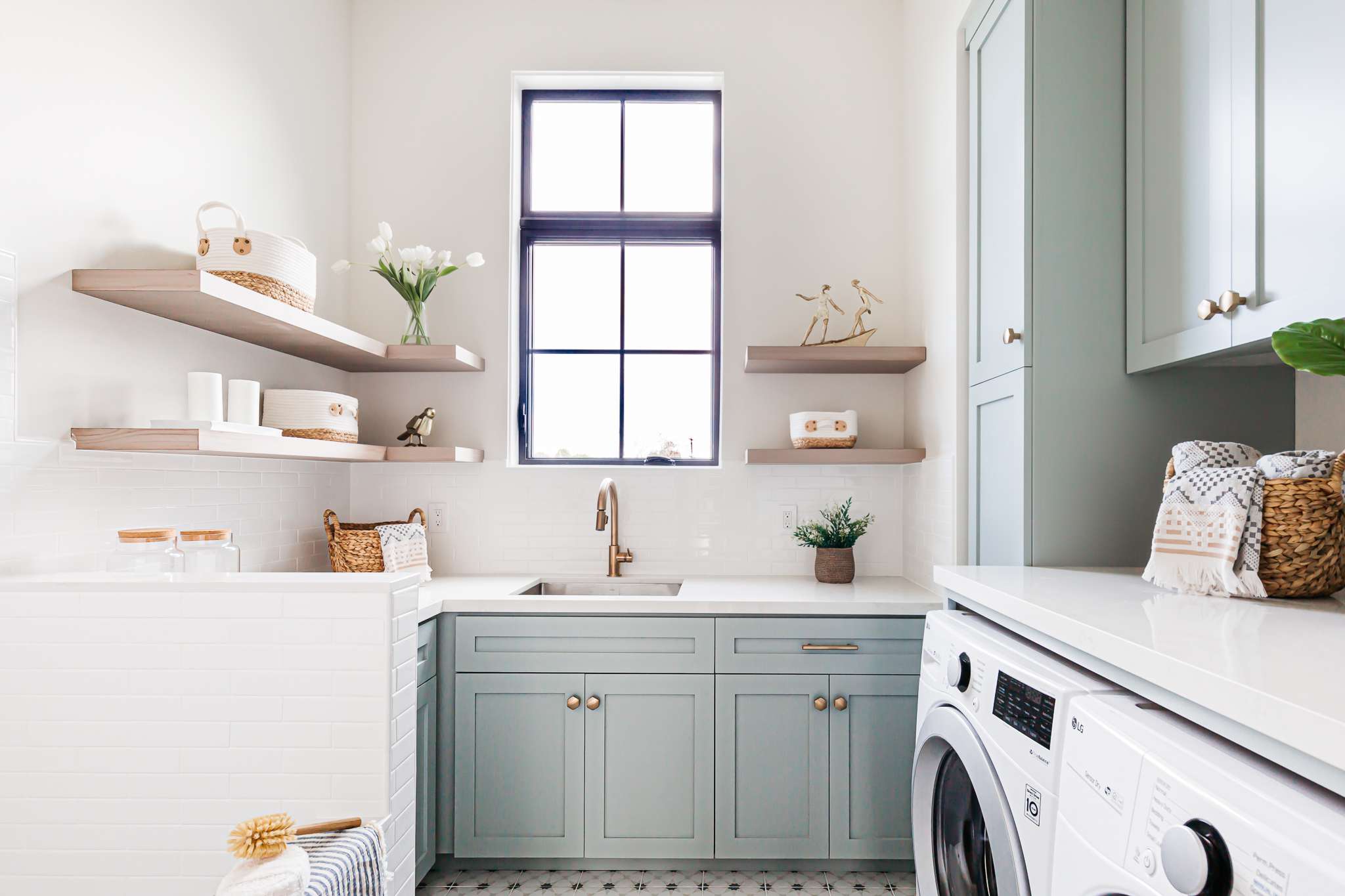 Clean, modern laundry room with well-maintained dryer and washer